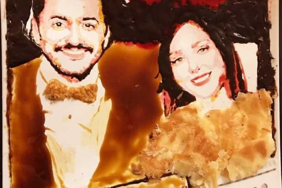 شاهدوا: بعد تصالحهما .. تامر حسني وبسمة بوسيل في رسم بالفطير والعسل والشيكولاتة