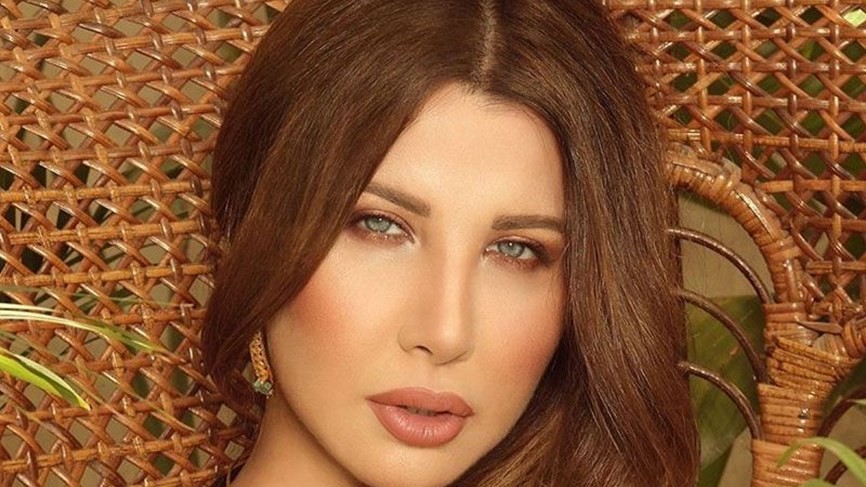 شاهدوا | بنات  الفنانة اللبنانية "نانسي عجرم" في أحد الشعانين حديث الجمهور