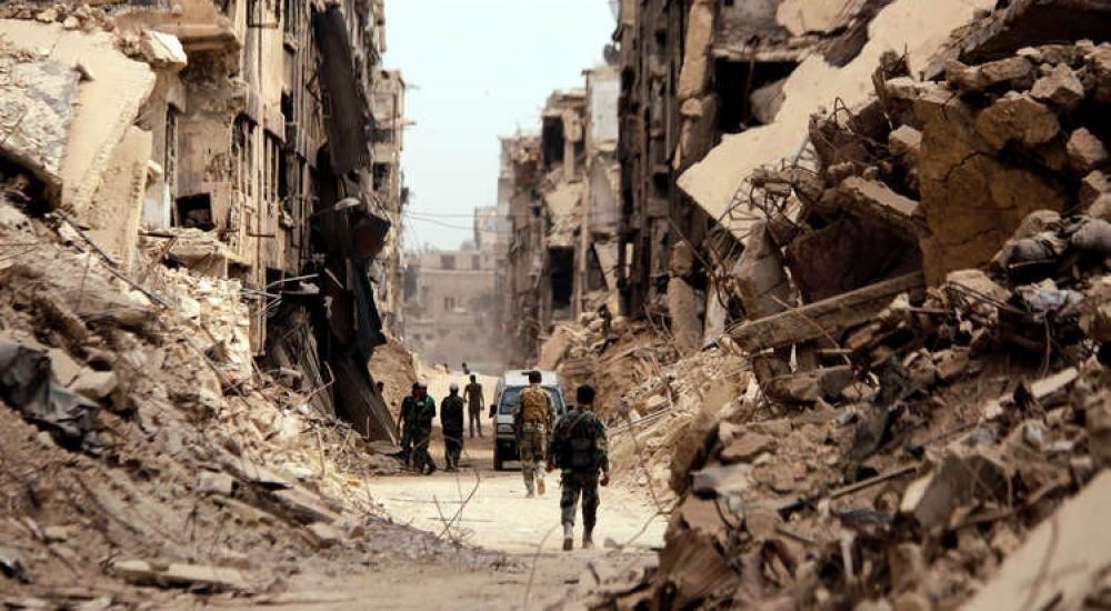 دمشق: أهالي مخيم اليرموك يُطالبون بإزالة الحواجز بين بلدة يلدا المجاورة 