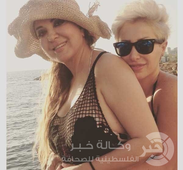 بالصور : مادلين طبر تستجم على شاطئ البحر برفقة ابنتها